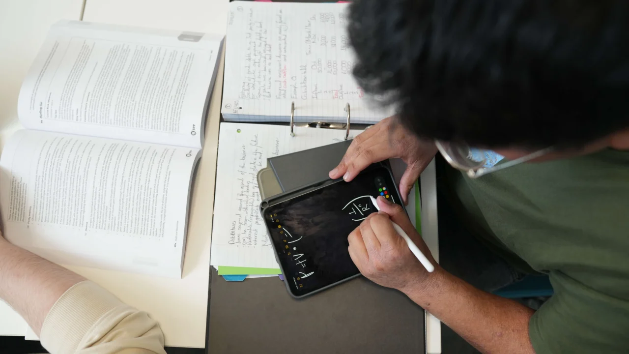 Business student in class working