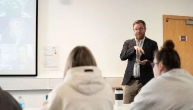 Education, Childhood and Professional Studies students in lecture room with laptop