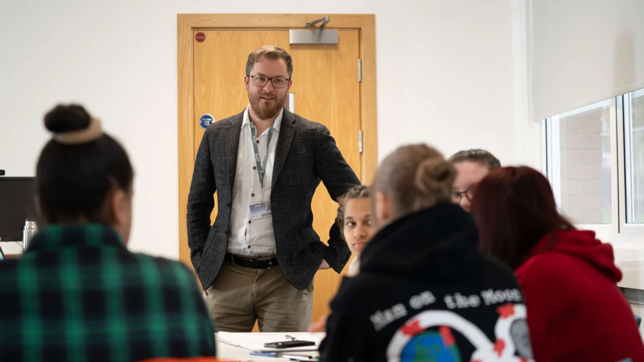 Education, Childhood and Professional Studies academic in class with students