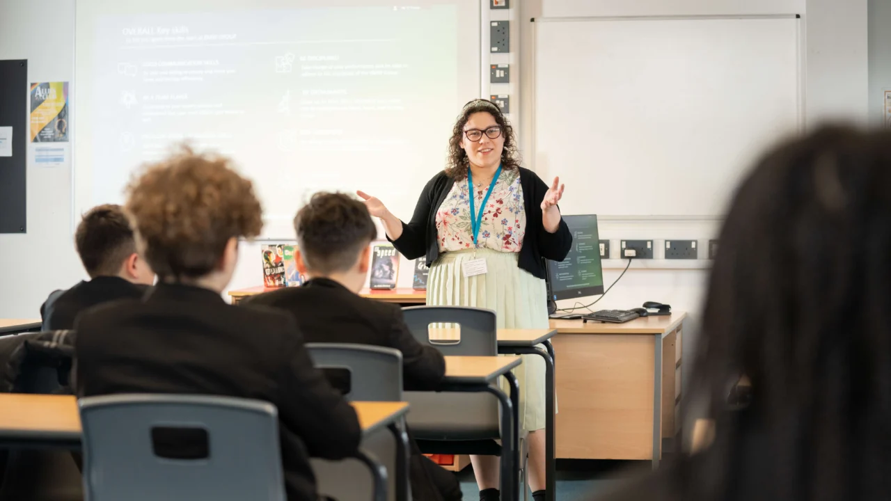 Secondary Education teacher in classroom with students