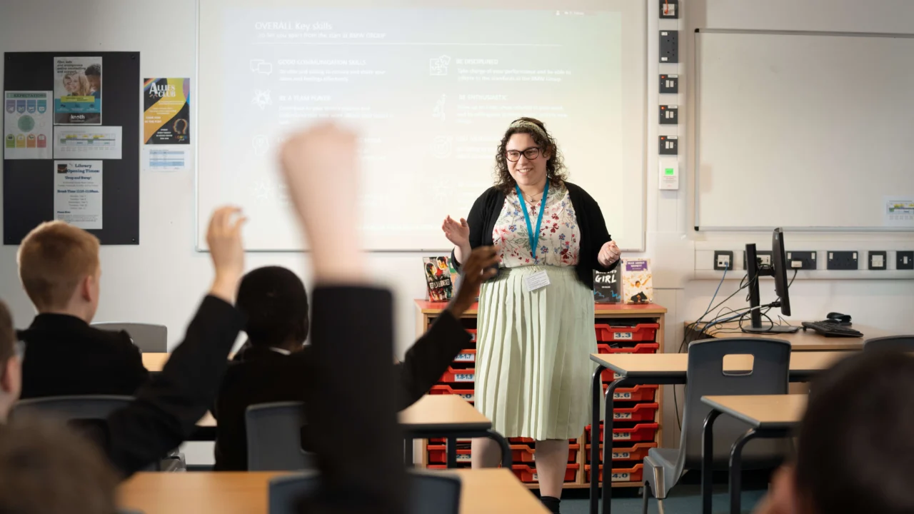 Secondary Education teacher in classroom with students
