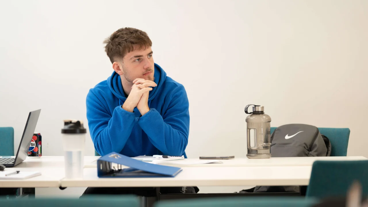 Student in class sitting at desk