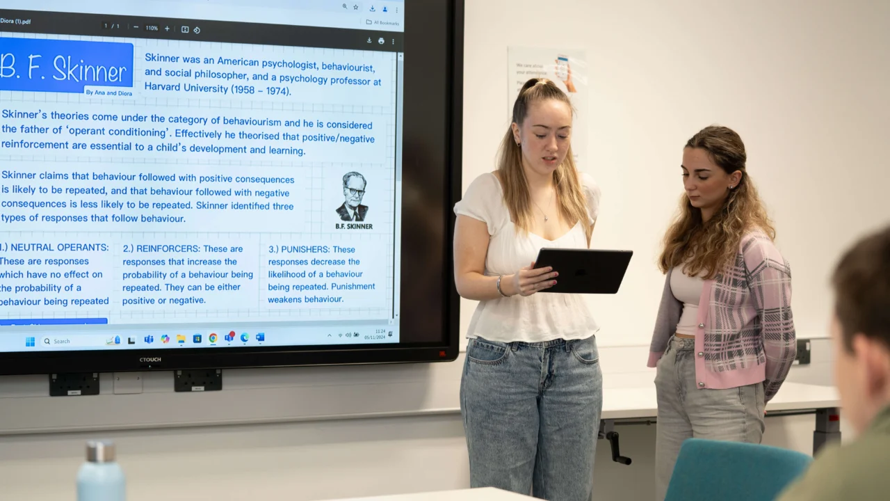 Secondary students at front of class