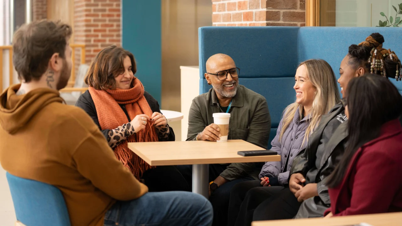 Group of students talking together in a social environment.